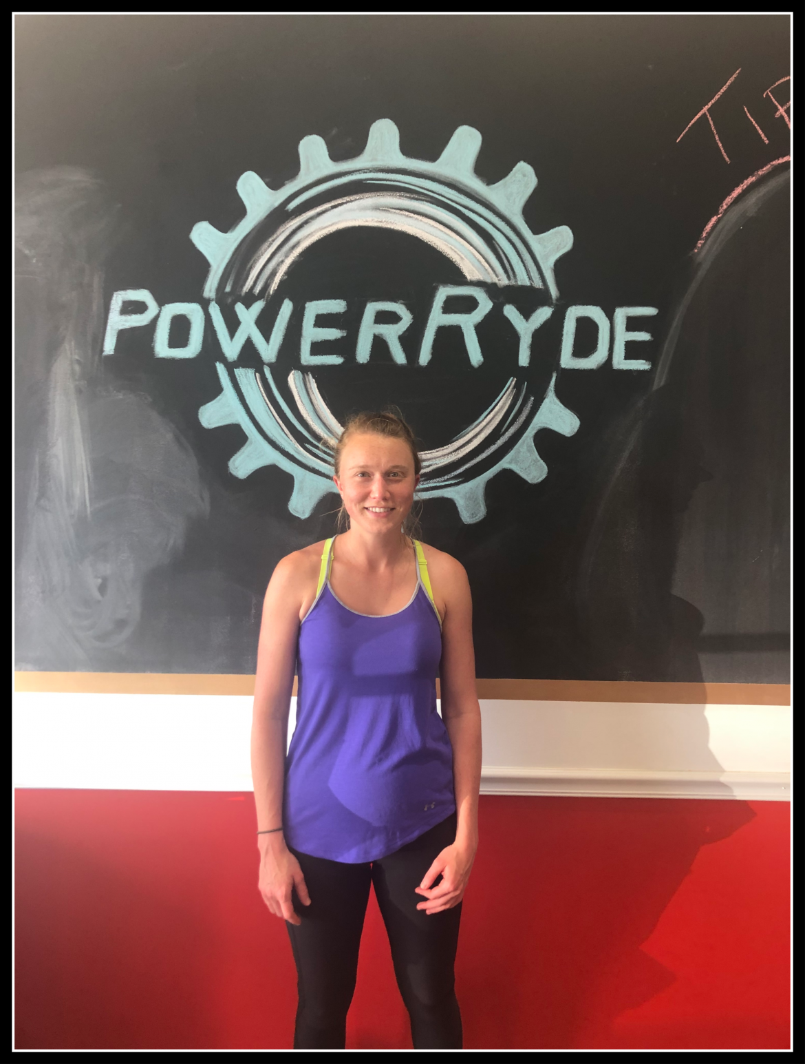 Jenna Swanson in front of chalk PowerRyde logo